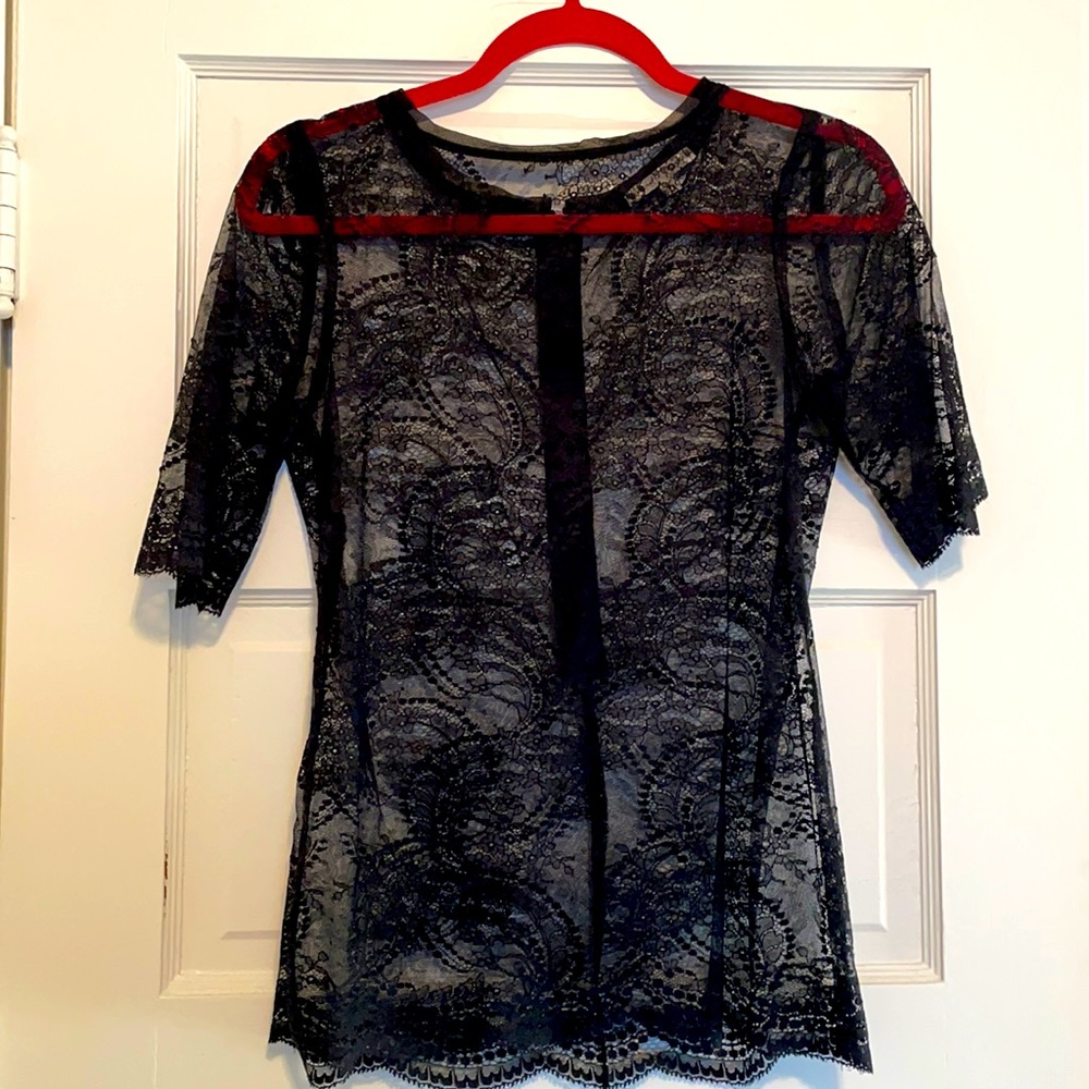 Black lace size 0 Nanette Lepore shirt. Zips up back. Short sleeves.